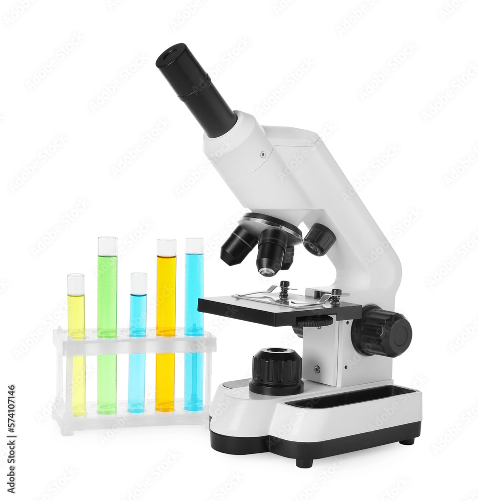 Test tubes with colorful liquids and microscope isolated on white Test tubes with colorful liquids and microscope isolated on white