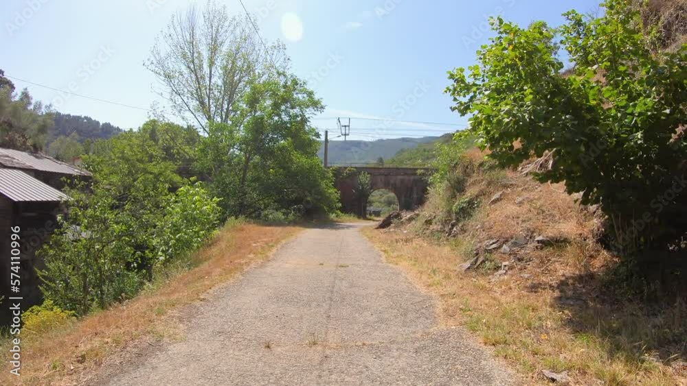Camino de Invierno - paved road close to the train station of Montefurado, Quiroga, province of Lugo, Spain - June 2022 Camino de Invierno - paved road close to the train station of Montefurado, Quiroga, province of Lugo, Spain - June 2022