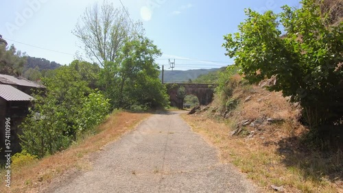 Camino de Invierno - paved road close to the train station of Montefurado, Quiroga, province of Lugo, Spain - June 2022 photo