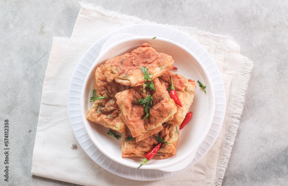 Martabak Mesir or Martabak Kubang is a snack made from flour dough containing eggs, seasoned meat, and leeks and served with vinegar sauce. Martabak Mesir or Martabak Kubang is a snack made from flour dough containing eggs, seasoned meat, and leeks and served with vinegar sauce.