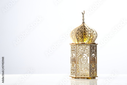 decorative lantern of mosque shape with light inside on white background