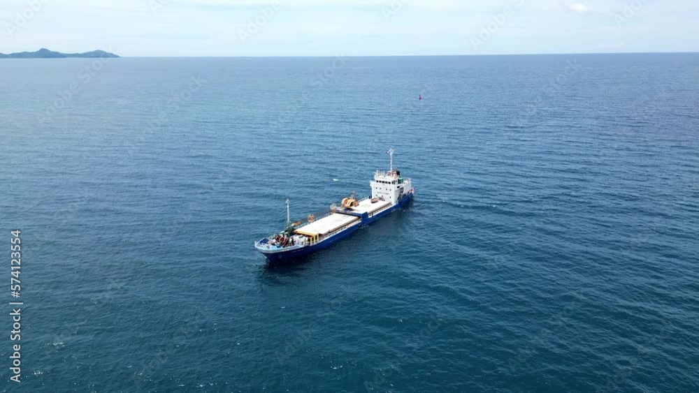 High Aerial Shot of Large Ship Sailing in Blue Sea in Virac, Catanduanes, Philippines Asia High Aerial Shot of Large Ship Sailing in Blue Sea in Virac, Catanduanes, Philippines Asia