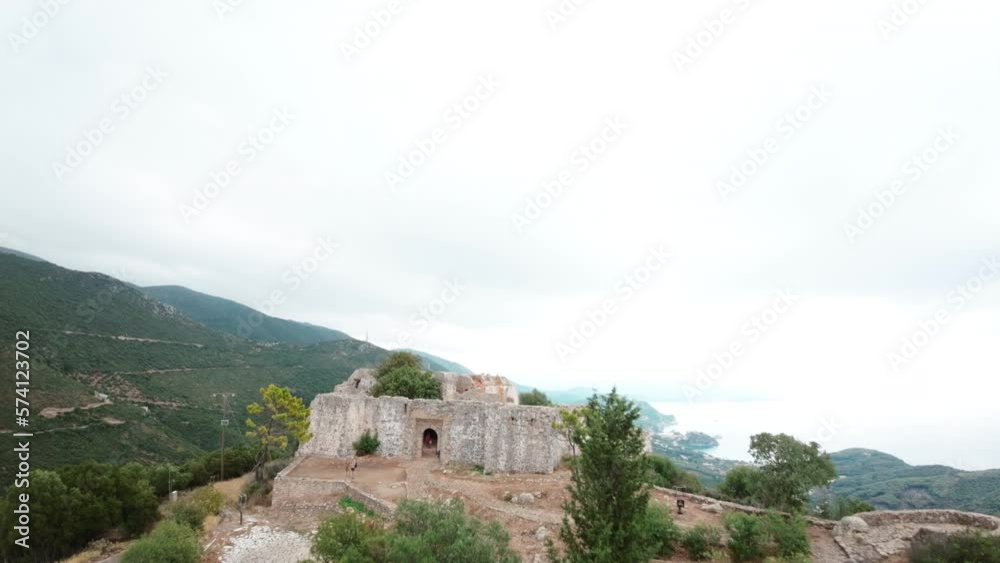 FPV drone flying over road towards castle in mountain. FPV drone flying over road towards castle in mountain.
