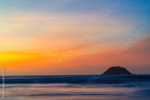 Colorful ocean beach sunrise. Beautiful sunrise on the tropical beach with sky and clouds for travel in holiday relax time