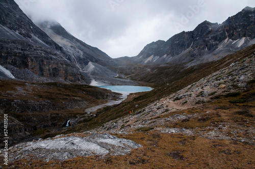 Colorful pond at a high attitude surrounded by majestic mountains