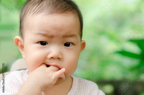 Portrait of a cute Asia baby boy Sucking fingers