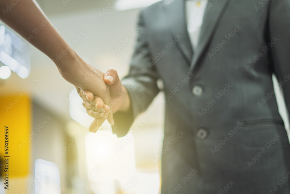 Businesswoman hands working with laptop computer, tablet and smartphone in modern office women shaking hands in the workplace team work