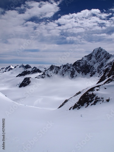 Fox glacier in New Zealand, mountain peaks with clouds over Glaciers © Danielle