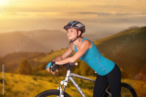 Happy young cyclist riding bicycle outdoor