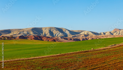 green agriculture and desertic mountain,  Moroccan landscape in the North photo