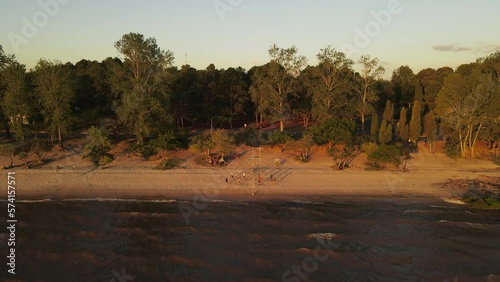 Slow Motion Shot Of Friends Playing Volley Ball On Fray Bentos Coast, Uruguay photo