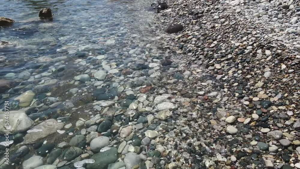 Mediterranean Sea lapping on pebbled Rocky Aphrodite Beach (Latchi) Cyprus Mediterranean Sea lapping on pebbled Rocky Aphrodite Beach (Latchi) Cyprus