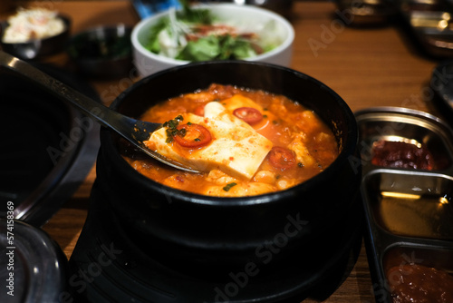 ‘Kimchi Jjigae’ or Kimchi Soup with Soft Tofu or Korean Kimchi Stew - Korean Food Traditional Style, (selective focus).