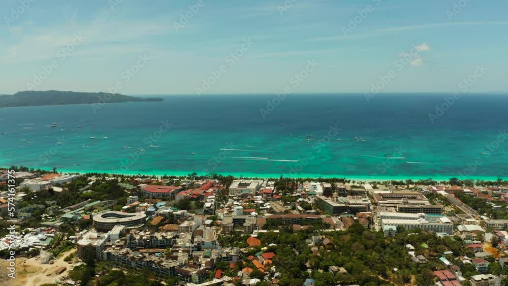 Tropical beach with tourists and clear blue sea, top view. Summer and travel vacation concept. Boracay, Philippines Tropical beach with tourists and clear blue sea, top view. Summer and travel vacation concept. Boracay, Philippines