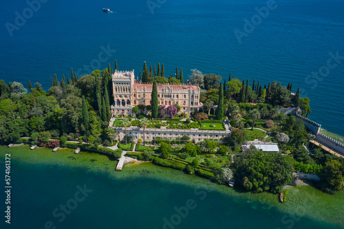 The Venetian neo gothic Villa Borghese Cavazza. Is the biggest island on Lake Garda. Aerial view of the island Garda, Lake Garda, Italy Aerial photography. photo