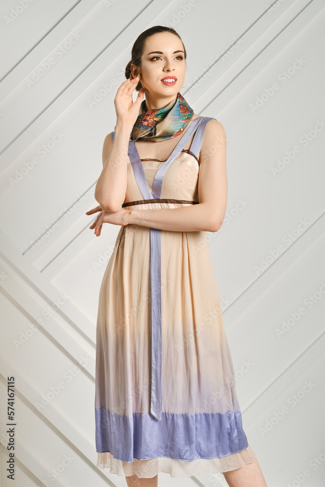 Dreamy woman with crossed hands and silk scarf on her neck Dreamy woman with crossed hands and silk scarf on her neck