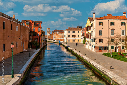Narrow canal and typical houses in Venice, Italy.