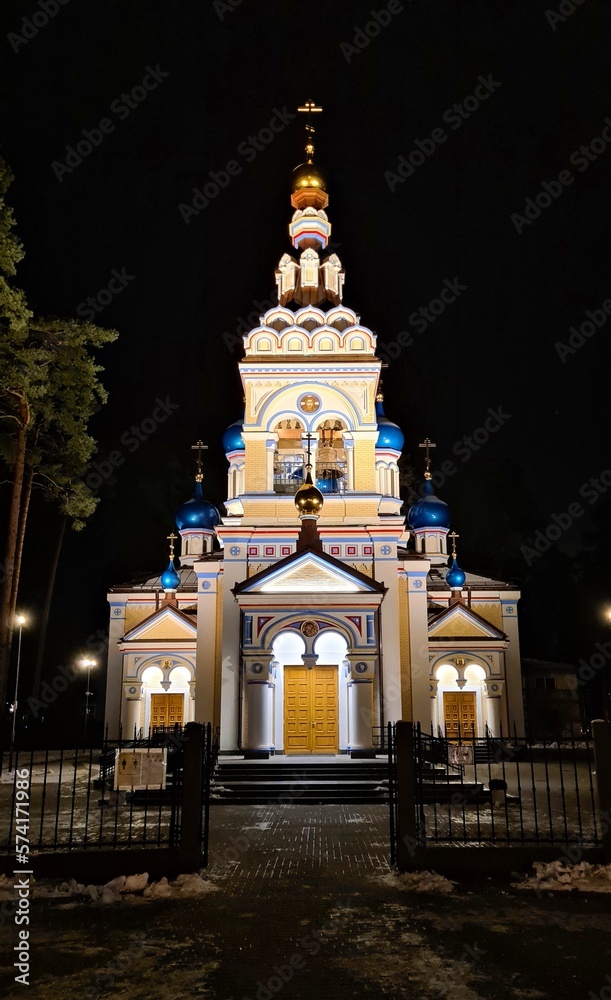 An Orthodox church is illuminated by floodlights at night in the Latvian city of Jurmala in January 2023