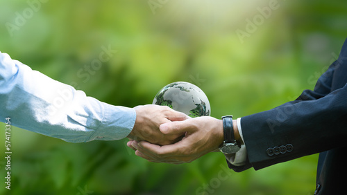 Businessmen Handshake Globe Glass Conservation In Green Forest Environment earth day forest conservation concept world environment day
