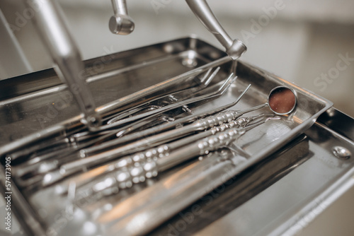 Macro shot of shiny dental tools on modern clinic
