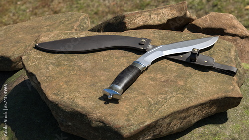 Fotografía Kukri knife and leather scabbard lying on a stone. 3D rendering