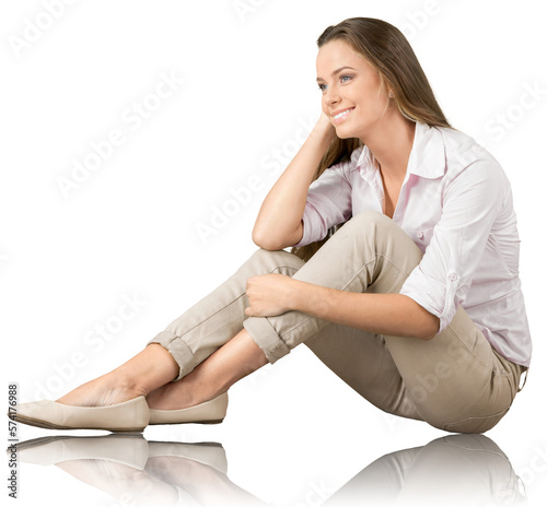 Quadro su tela Portrait of a young  pretty woman sitting isolated on background