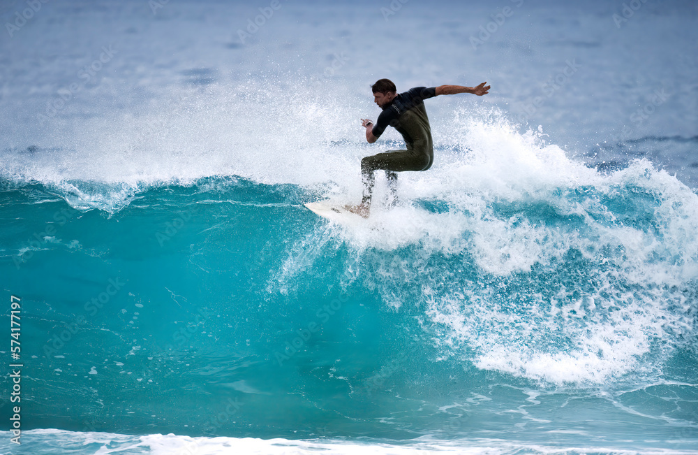 Professional surfer riding ocean waves On banzai pipeline north shore Oahu Hawaii. Surfing a large sea wave on short surfboard in the summer sun. Professional surfer riding ocean waves On banzai pipeline north shore Oahu Hawaii. Surfing a large sea wave on short surfboard in the summer sun.