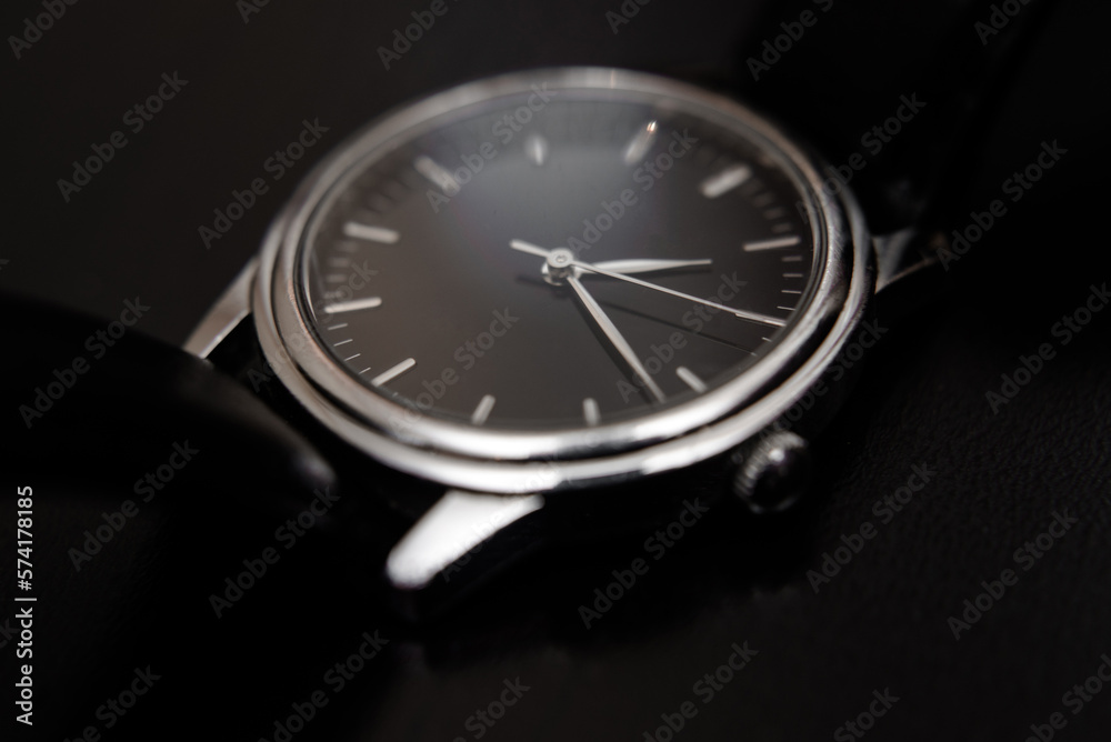 Quartz wristwatch with black dial close-up
Quartz wristwatch with black dial close-up