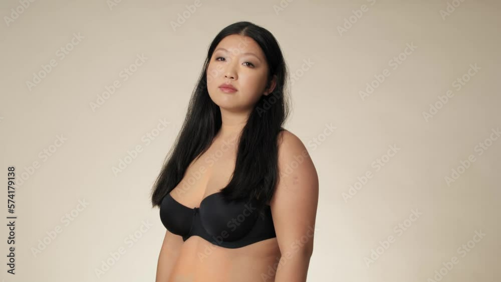 Portrait of Chinese woman in underwear in the studio. Shot with RED helium camera in 8K. Portrait of Chinese woman in underwear in the studio. Shot with RED helium camera in 8K.
