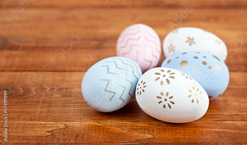 Easter eggs close-up on a wooden table with copy space