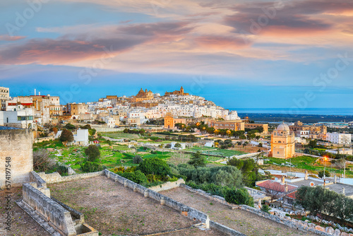 Attractive view on Ostuni white town skyline and Madonna della Grata church