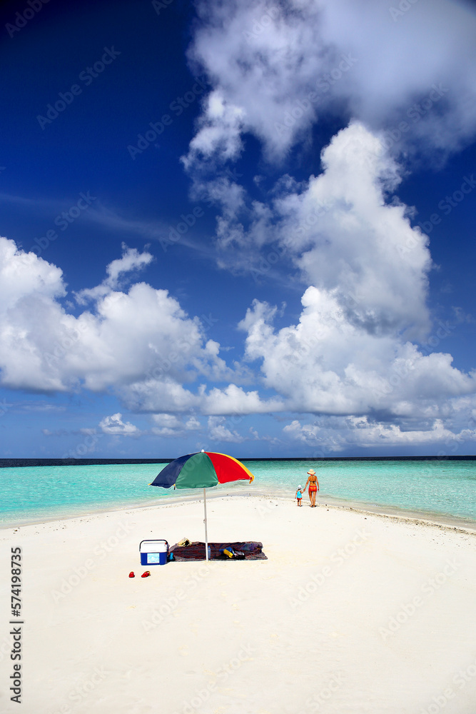 Woman and daugther on sandbank, Kaafu Atoll, Maldives Woman and daugther on sandbank, Kaafu Atoll, Maldives