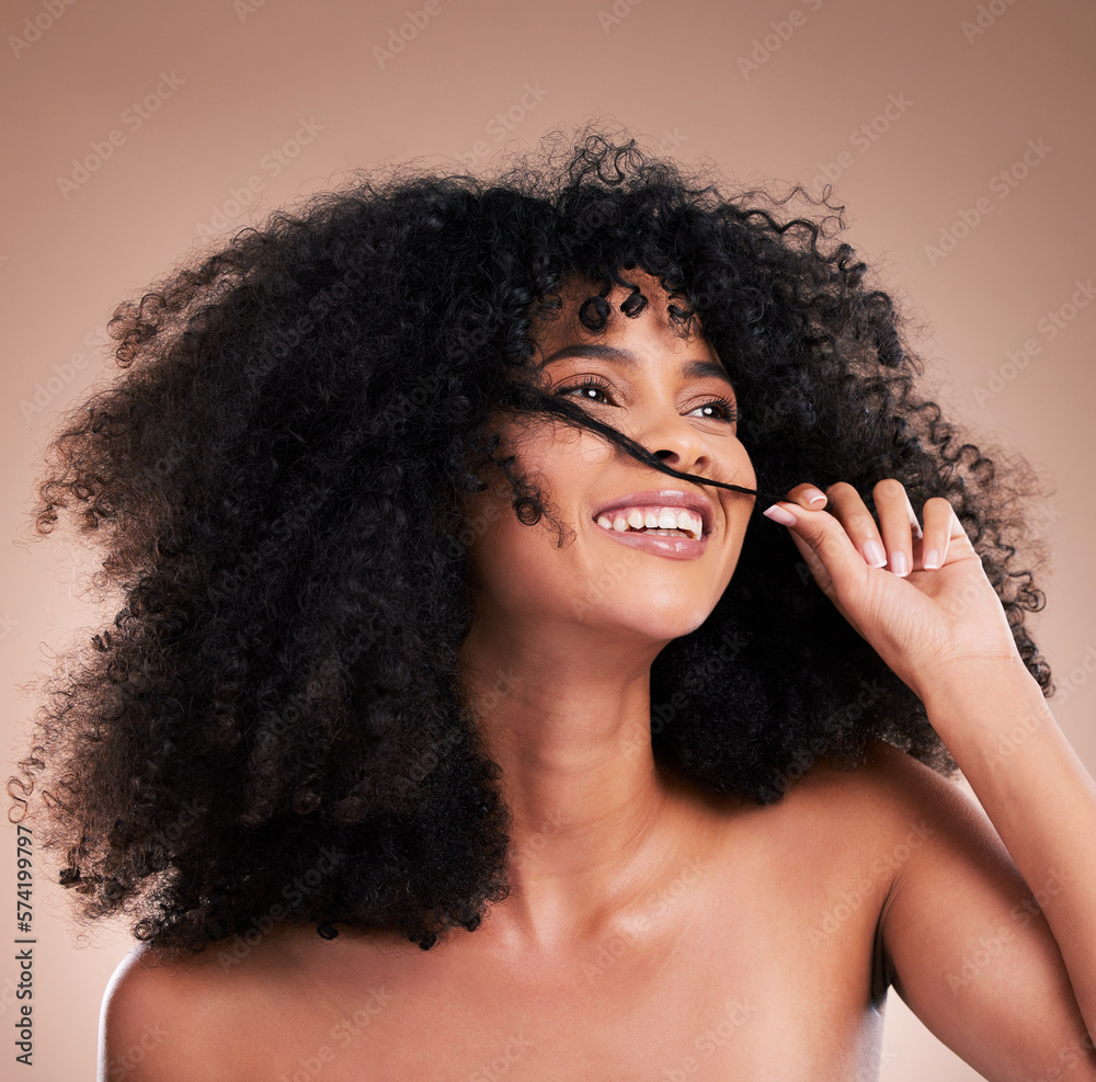 Obraz premium Afro, beauty and face of black woman with hair in hands on brown background for wellness, shine and natural glow. Salon, luxury treatment and happy girl smile with curly hairstyle, texture and growth