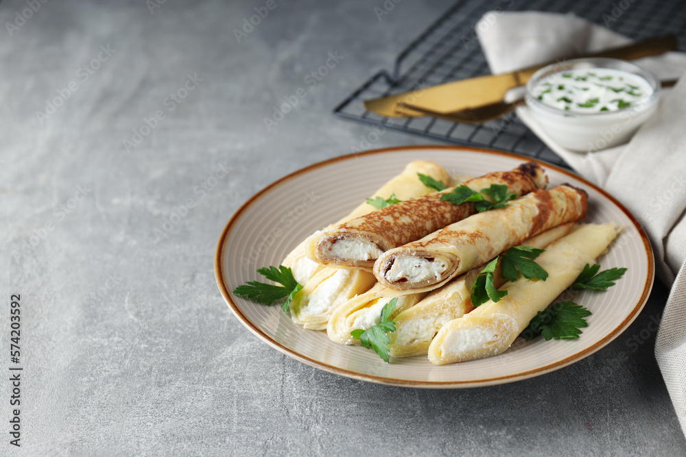 Concept of tasty food, thin pancakes with filling, space for text Concept of tasty food, thin pancakes with filling, space for text