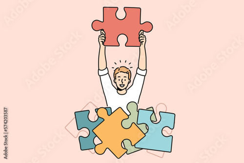 Smiling man with jigsaw puzzles brainstorm find solution to business problem. Happy male employee connect puzzles look for solution. Vector illustration. 
