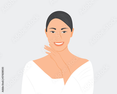 A beautiful young woman smiles happily, she has a clear skin by taking care of her health.