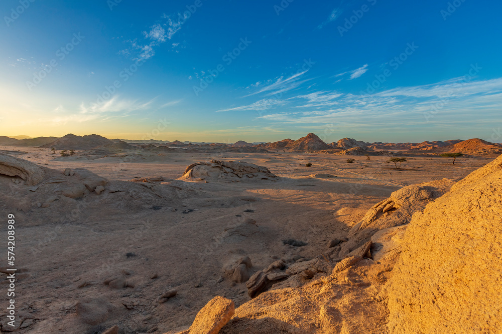 Sunset light illuminates the desert landscape, Egypt.