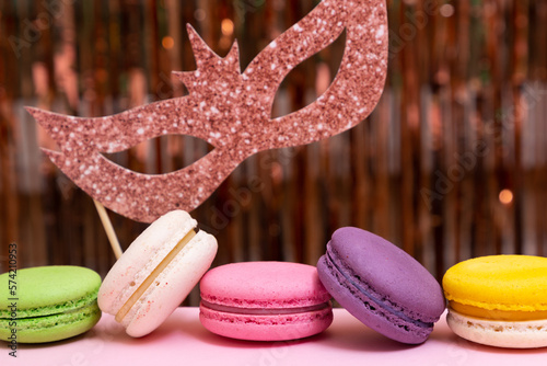 Sweet colorful macarons  on pink background. Tasty colourful macaroons. High quality photo