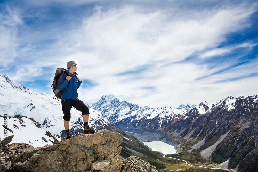 Hiker with backpack on the mountain top. Sport and active life concept Hiker with backpack on the mountain top. Sport and active life concept