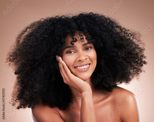 Afro, hair and portrait of black woman with smile on brown background for wellness, shine and natural glow. Beauty salon, luxury treatment and happy girl face for curly hairstyle, cosmetic and growth