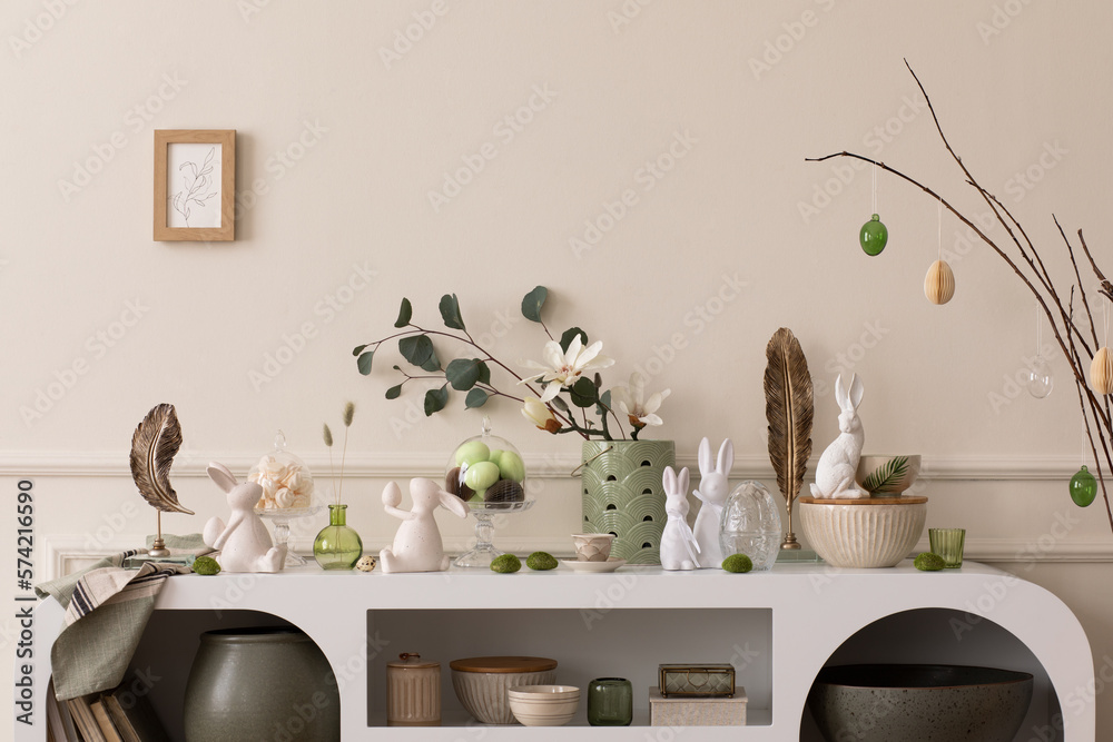 Interior design of easter living room interior stylish sideboard, colorful  easter eggs, easter bunny sculpture, vase with leaves, magnolia and  personal accessories Home decor. Template. Stock-Foto | Adobe Stock