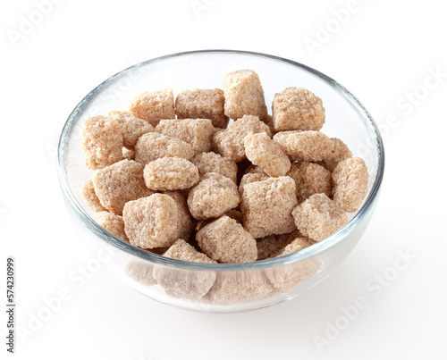 Cubes of brow cane sugar in glass bowl isolated on white background with clipping path