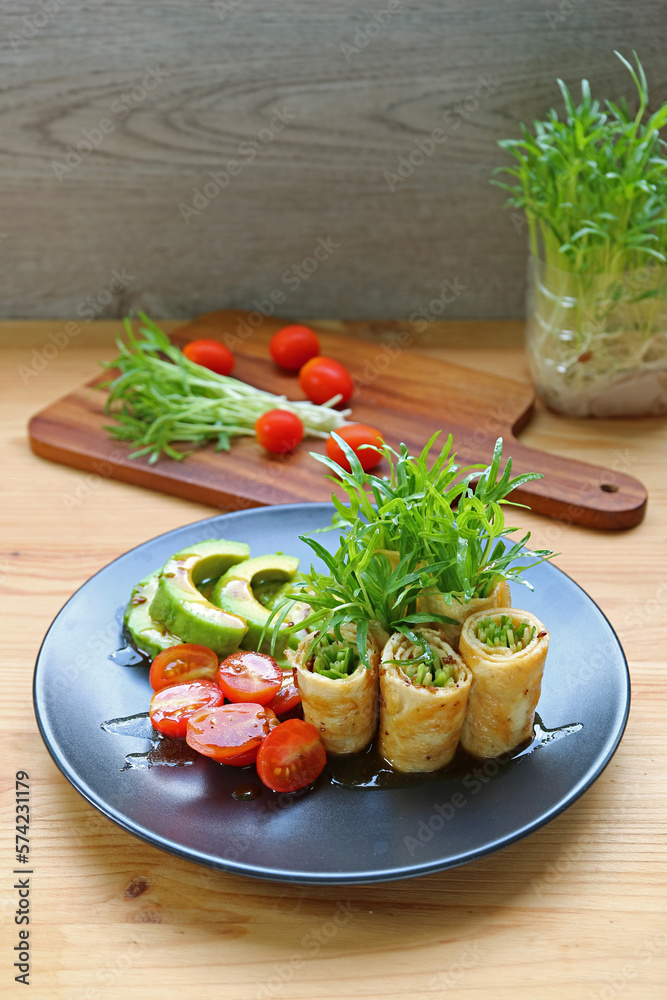 Delectable Freshly Harvest Water Spinach Microgreens Egg Rolls with Tomato and Avocado Salad Delectable Freshly Harvest Water Spinach Microgreens Egg Rolls with Tomato and Avocado Salad