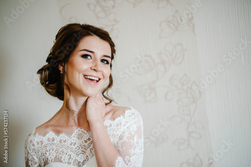 Beauty portrait of bride wearing fashion wedding dress with luxury delight make-up and hairstyle, studio indoor photo. Attractive model. Prom.