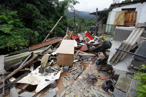 A house stands damaged by a landslide caused by heavy rains in Boicucanga beach, coastal city of Sao Sebastiao, Sao Paulo state, Brazil. photo