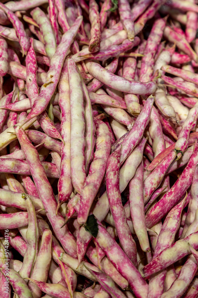 A full frame photograph of borlotti beans in their shell, with a shallow depth of field A full frame photograph of borlotti beans in their shell, with a shallow depth of field
