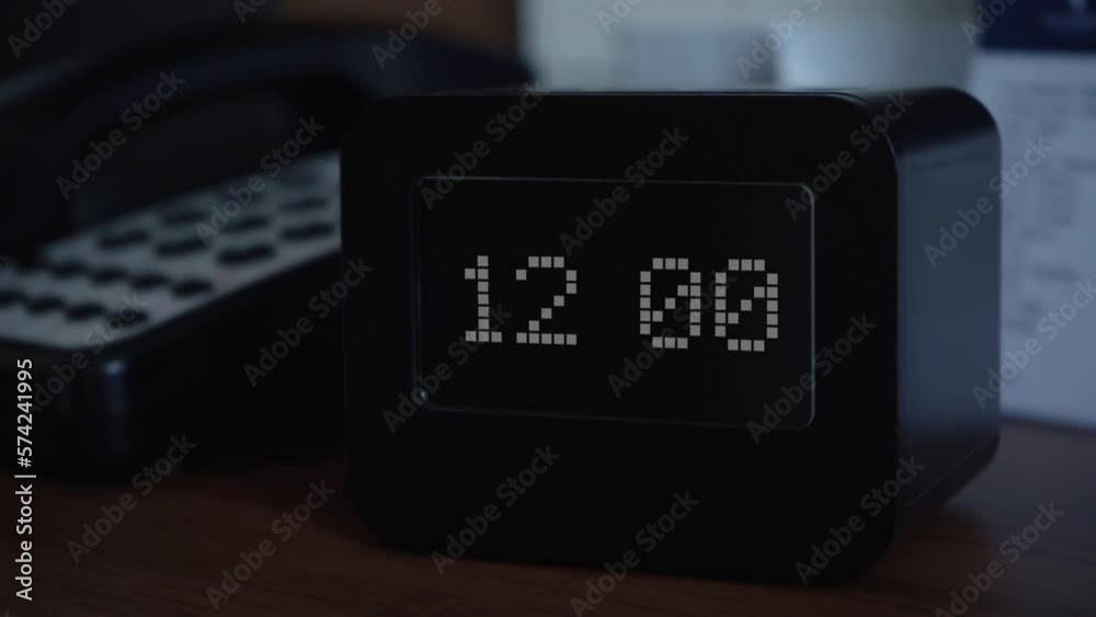 The clock or alarm clock shows the time 12 o'clock. Time display on the electronic scoreboard. Wake up or getting up for work, study or in connection with an important