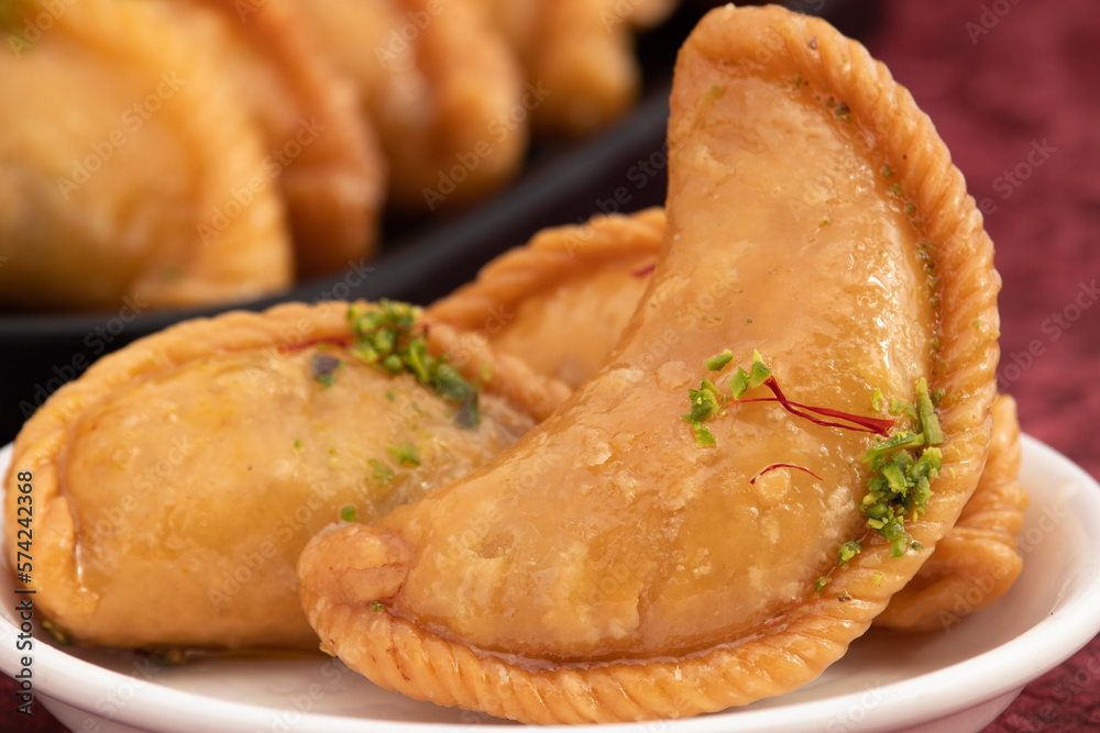 Gujia Also Called Gujiya, Pirukiya, Pirukia, Pedakiya, Karanji, Basundi Or Gughra Stuffed With Mawa, Khoya, Chasni, Mava, Khoa - Indian Sweet Dumpling Enjoyed On Deepawali, Teez, Holi, Diwali And Teej Gujia Also Called Gujiya, Pirukiya, Pirukia, Pedakiya, Karanji, Basundi Or Gughra Stuffed With Mawa, Khoya, Chasni, Mava, Khoa - Indian Sweet Dumpling Enjoyed On Deepawali, Teez, Holi, Diwali And Teej