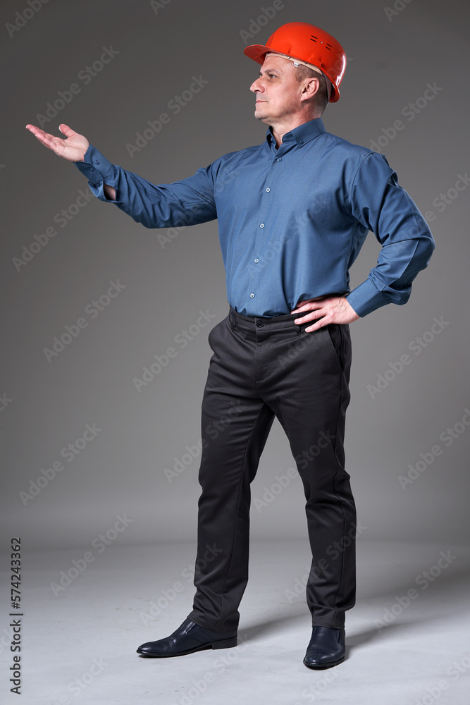 Mature engineer displaying something Mature engineer displaying something
