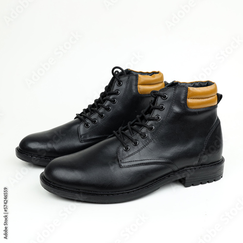 pair of black leather boots